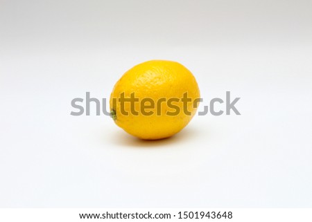 Fresh, ripe, isolated, juicy single lemon on a white background. Studio macro shoot