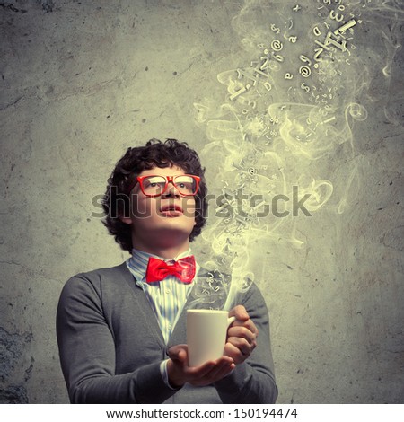Young man with smoke coming out of a cup experimenting