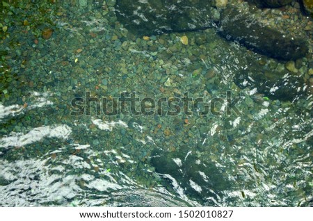 river rocks under the water