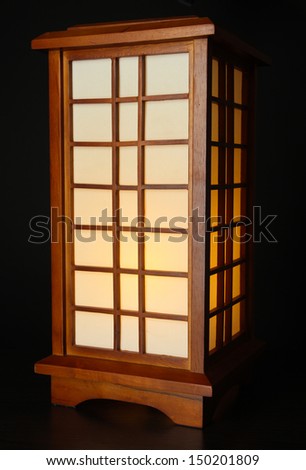 Japanese table lamp on black background