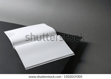 Empty book pages on dark background. Mockup for design