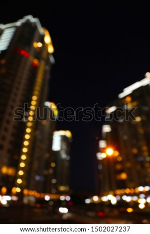 Blurred view of night cityscape with bokeh effect