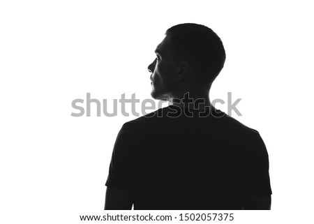 silhouette of man from behind on white background looks away Royalty-Free Stock Photo #1502057375