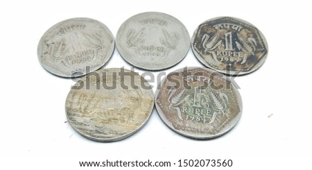 A picture of one rupee's coins on a white background