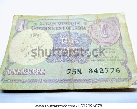 A picture of old and rare one rupee notes on white background