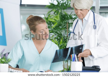 two female medical workers talking