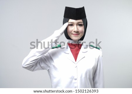 Close up photo young girl Indonesian National Flag Hoisting Troop. National Paskibraka Council isolated in white Royalty-Free Stock Photo #1502126393