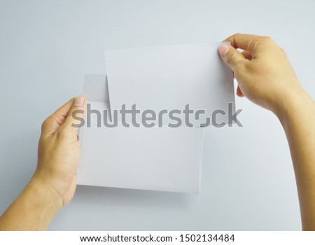Hand holding Blank Envelope Mock-up, ready to replace your design