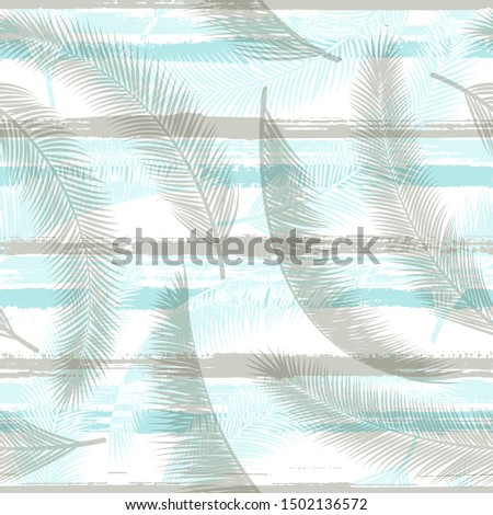 Tropical coconut palm leaves tree branches over painted stripes seamless pattern design. Indonesian jungle foliage beach fashion fabric print. Stripes and tropical leaves illustration.