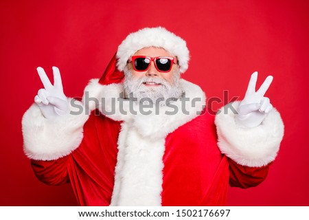 Close-up portrait of his he nice attractive cheerful cheery peaceful bearded Santa showing double v-sgn festive festal mood isolated over bright vivid shine red background