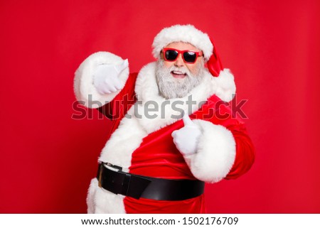 Close-up portrait of his he cheerful cheery glad confident funky fat overweight plump gray-haired bearded man showing thumbup ad advert isolated over bright vivid shine red background