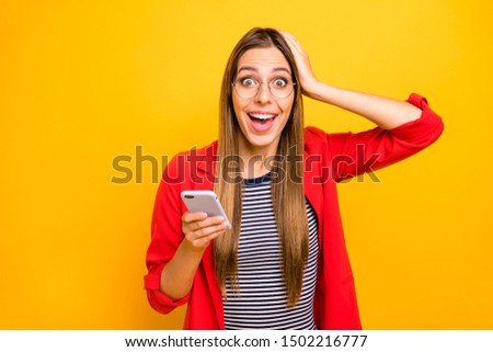 Portrait of stylish trendy girl touching her head screaming wearing eyeglasses eyewear isolated over yellow background
