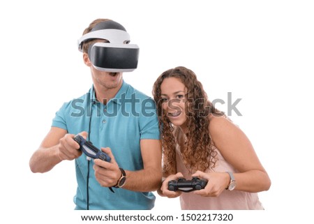 couple or siblings of young caucasian boys playing with reality glasses and virtual console controller enjoying and laughing together isolated in white background