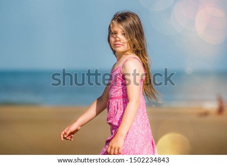 beautiful girl walking on the beach