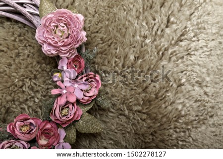 Wreath with dry plants and flowers close up photo