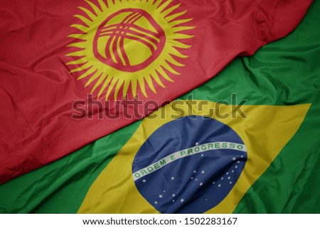 waving colorful flag of brazil and national flag of kyrgyzstan. macro