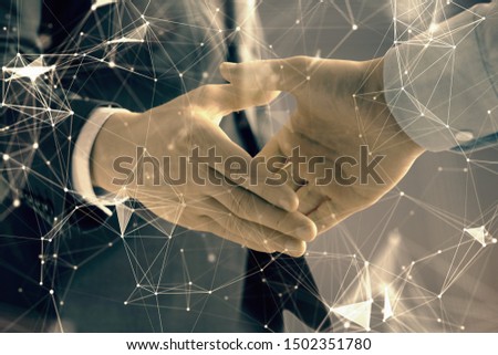 Double exposure of tech drawing on abstract background with two men handshake. Concept of technology in modern business