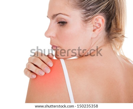 Close up of woman having shoulder pain isolated on white background