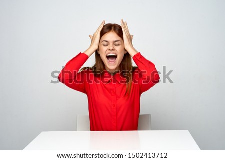 Business woman red shirt desk official emotions