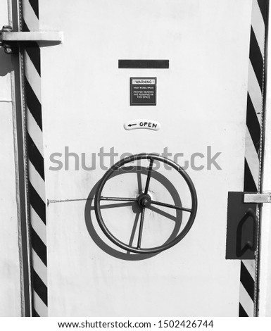 Picture of watertight ship door in black and white