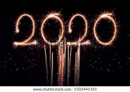 
Happy New Year 2020. Creative text Happy New Year 2020 written sparkling sparklers isolated on black background for design