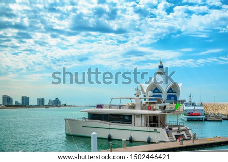background of blue sky with beautiful clouds and azure sea with Marina and yachts. the focus is selective.