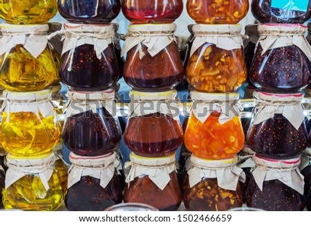 Jars of jam from various berries and fruits. Assortment of jams.