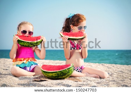 Happy two children of the sea with watermelon 