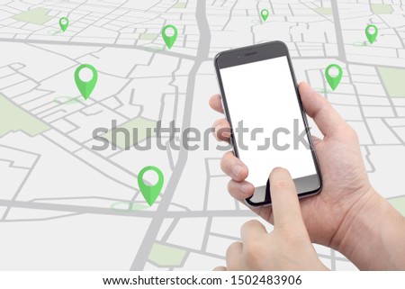 Hand holding smartphone with street map and pins green color