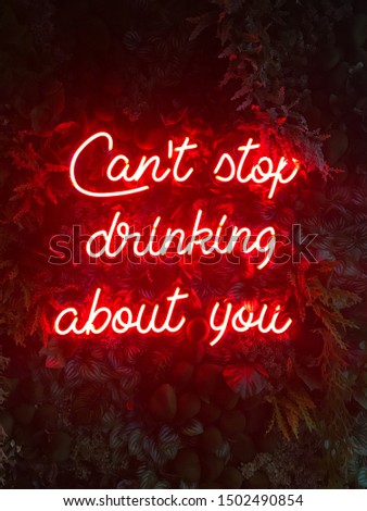 Neon text on green leaf wall, Can't stop drinking without you