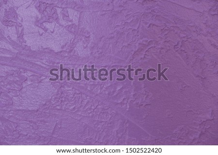 purple painted shabby house wall