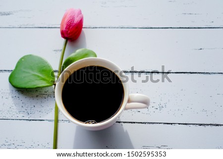 Coffee and flowers in the morning, space for your message.                       
