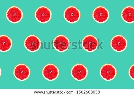 Pink grapefruit pattern isolated on mint background