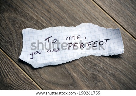 To me, you are Perfect - Hand writing text on a piece of paper on wood background