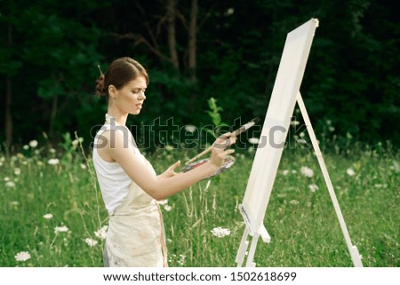 woman paints a paint picture, artist
