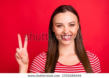 Close up photo of nice cute charming beautiful girlfriend showing you v-sign while isolated with red background