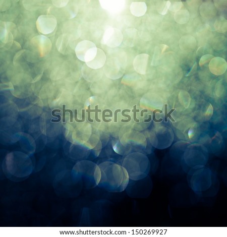 Abstract background (raindrops on a window dispersing and reflecting light)