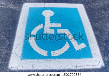 Handicapped parking logo on concrete