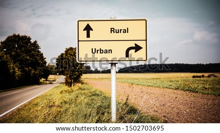 Street Sign the Direction Way to Rural versus Urban Royalty-Free Stock Photo #1502703695