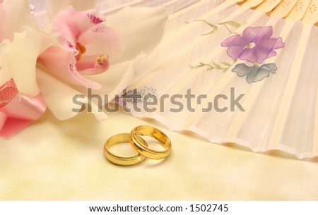 Orchid Flower with Wedding Rings and Fan