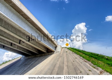 Overpass with right lane ends sign Royalty-Free Stock Photo #1502746169