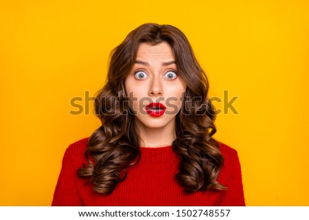 Photo of curly wavy feared terrified horrified astonished girlfriend emotional with frightful face expression seeing something negatively unbelievable isolated over yellow bright color background