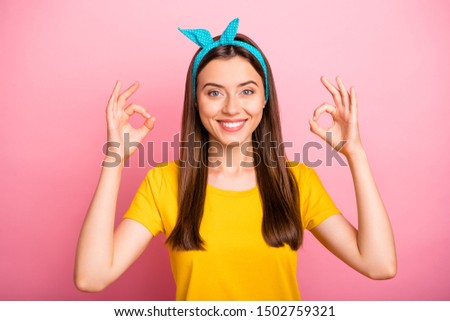 Photo of gorgeous marvelous wonderful incredible girl so joyful about her new clothes that showing you sign of recommending with two hands at once while isolated with vivid background