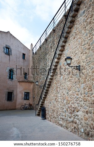 Spain, Tossa de Mar, a fragment of the medieval city wall and stairs up