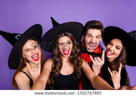 Close up photo of fun funny funky dark creatures rock-and-roll witches sorcerer enjoy october halloween party event show horned sign symbol  make v-signs isolated over violet purple color background
