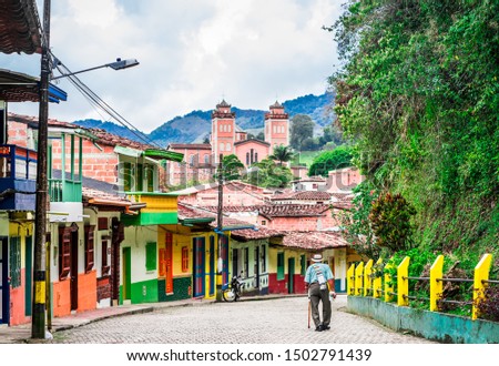 Old man in the streets of colonial village in the center of Jerico, Colombia Royalty-Free Stock Photo #1502791439