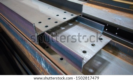 Assortment steel profiles in steel fabrication shop Royalty-Free Stock Photo #1502817479