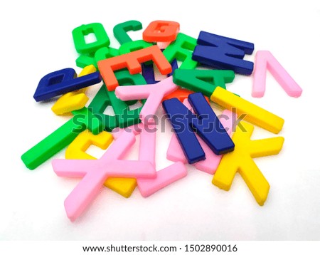 plastic alphabet letters isolated on white background