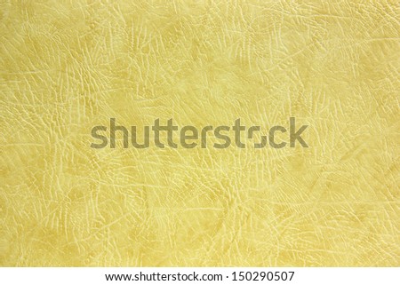 Photo of texture of gray-yellow crumpled leather