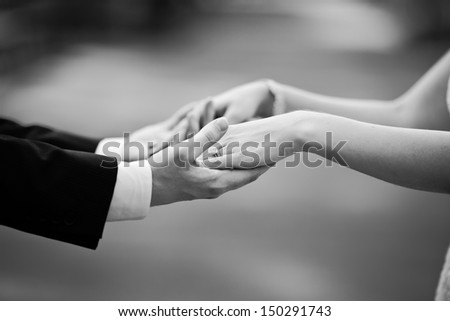  newly wed couple holding hands, marry me ! Royalty-Free Stock Photo #150291743